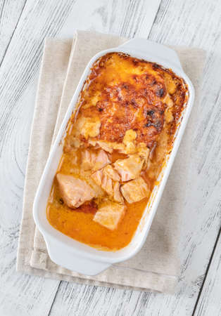 Baked salmon with cheese and sriracha sauceの写真素材