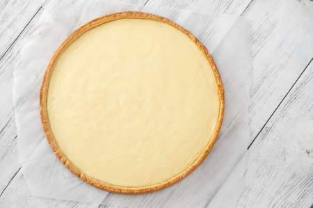 Traditional cheesecake on the wooden table flat layの写真素材