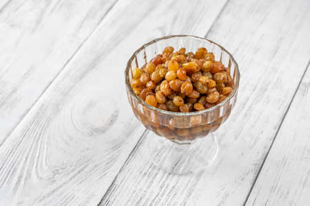 Glass of boerenjongens - raisins soaked in brandy - Dutch dessertの写真素材