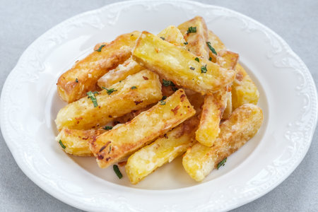 Portion of potato French fries on the plate