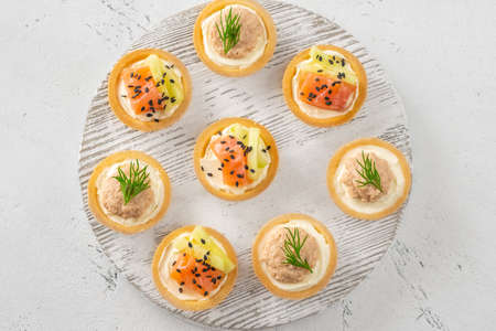 Canapes with cream cheese, cod roe and salmon