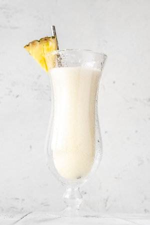 Chi Chi Organico cocktail garnished with pineapple wedge