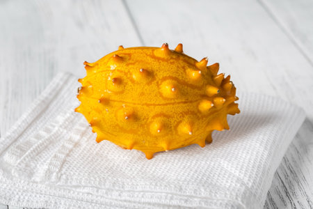 African horned cucumber on the wooden tableの写真素材