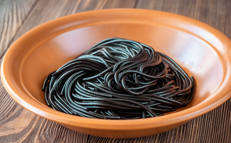 Portion of black squid ink spaghetti pastaの写真素材