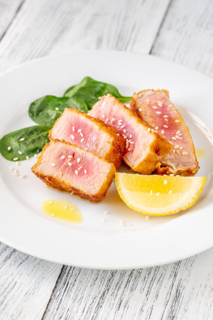 Sliced tuna steak on the white plate