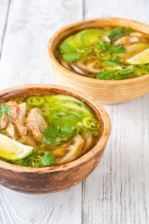 Green chili with chicken, beans and avocadoの写真素材