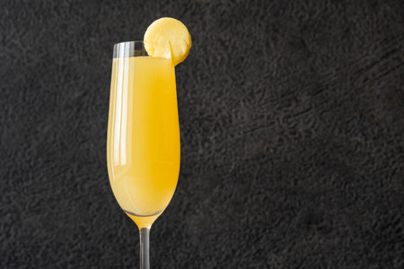 Pineapple Mimosa Cocktail garnished with pineapple sliceの写真素材