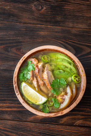 Green chili with chicken, beans and avocadoの写真素材