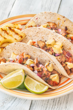 Tacos al pastor mexican dish with pork and pineapple