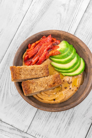 Bowl of baked eggplant and bell pepper dipの写真素材