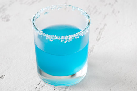 Glass of Haisenberg Cocktail garnished with salt rimの写真素材