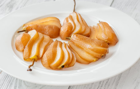 White wine spicy and sweet poached pearsの写真素材