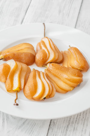 White wine spicy and sweet poached pearsの写真素材