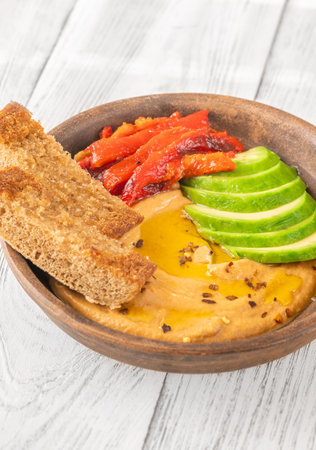 Bowl of baked eggplant and bell pepper dipの写真素材