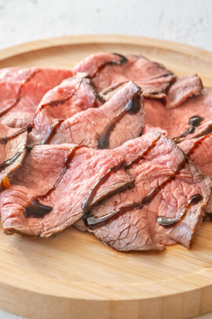 Portion of sliced roast beef on the plateの写真素材