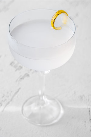 Cocktail garnished with flamed lemon zest twistの写真素材