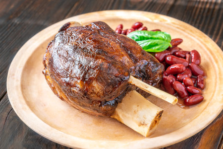 Glazed cooked pork hock with kidney beansの写真素材