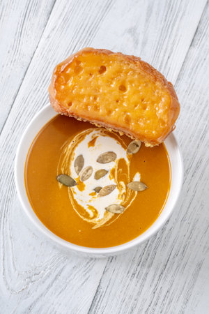 Bowl of spicy butternut squash creamy soupの写真素材