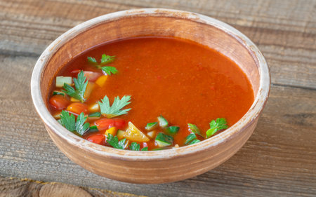 Bowl of gazpacho soup garnished with parsleyの写真素材