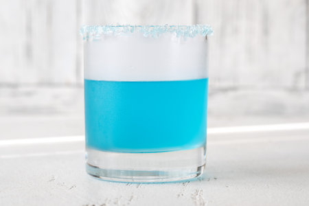 Glass of Cocktail garnished with salt rimの写真素材