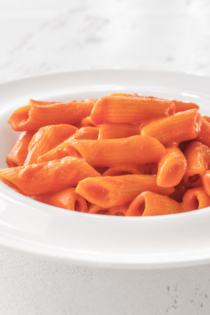 Penne pasta with bell pepper and cream sauceの写真素材