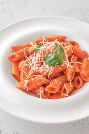 Penne pasta with bell pepper and cream sauceの写真素材