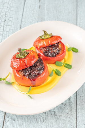 Red bell peppers stuffed with ground beefの写真素材