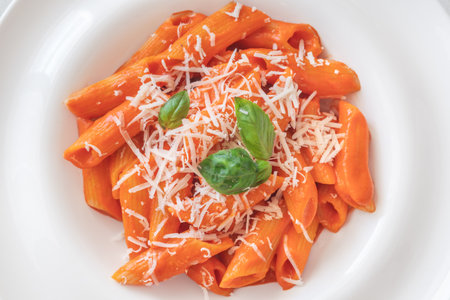 Penne pasta with bell pepper and cream sauceの写真素材