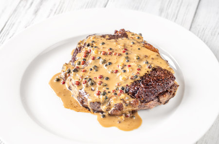 Steak au poivre - french steak with peppercorn sauceの写真素材