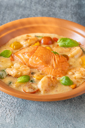 Salmon with prawn tomato coconut milk sauceの写真素材