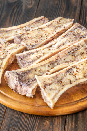 Halved bones baked to golden perfection, textures glisten with flavorful meaty depthの写真素材