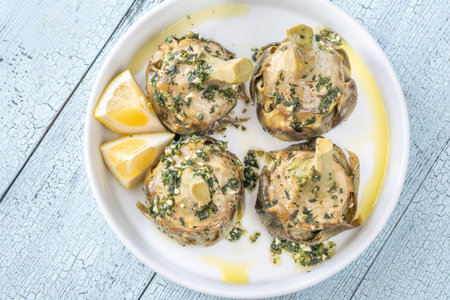 Classic Carciofi alla Romana with herbs, olive oil, and delicate flavorsの写真素材