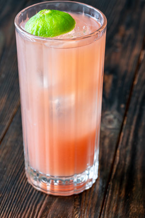 Bright guava, crisp gin, and soda fizz together in tropical refreshmentの写真素材
