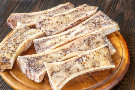 Halved bones baked to golden perfection, textures glisten with flavorful meaty depthの写真素材