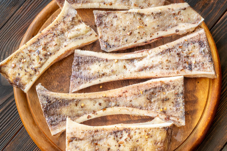 Halved bones baked to golden perfection, textures glisten with flavorful meaty depthの写真素材