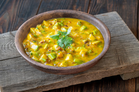 Avocado, mango, red onion, and lime combine in vibrant handcrafted salsa bowlの写真素材
