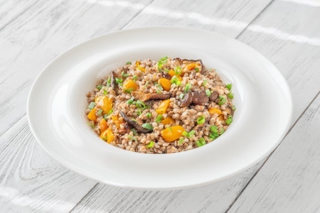 Warm buckwheat served with shiitake mushrooms, bell peppers, hearty healthy simplicityの写真素材