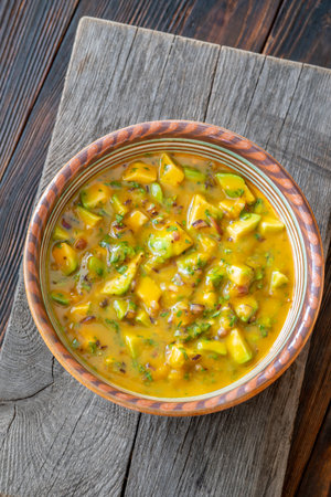 Avocado, mango, red onion, and lime combine in vibrant handcrafted salsa bowlの写真素材