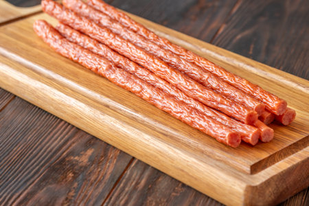 Close up food photo emphasizing wrinkled smoked sausage texture with rich rustic appetizing...