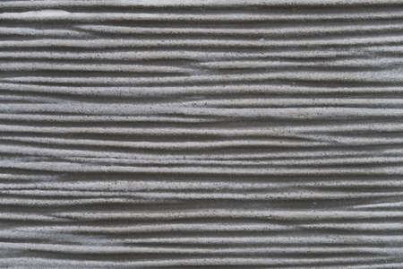 Ceramic surface with horizontal stripes and groovesの写真素材
