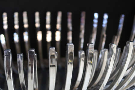 Shiny metallic slightly curved pieces with a silver sheenの写真素材