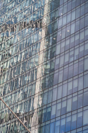 Reflection in the glass wall of the Moscow City skyscraperの写真素材