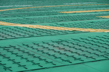 Metal surface of the helipad, background in green tonesの写真素材