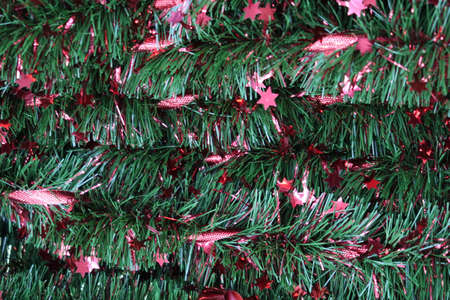 Green Christmas tree with red stars Christmas tinsel, backgroundの写真素材