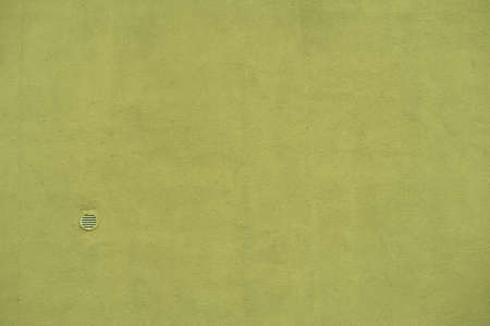 Smooth plaster surface with small ventilation holeの写真素材