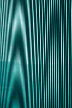 Vertical metal strips, an element of decor in architectureの写真素材