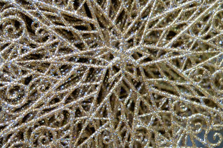 Artificial snowflakes strewn with sequins, festive background
