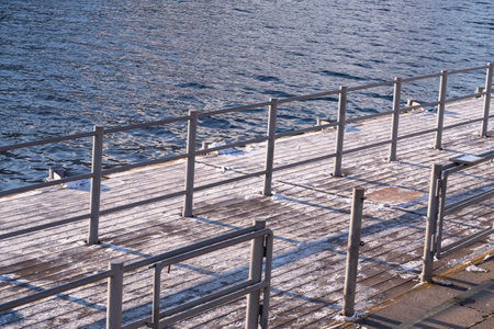 Turnstiles at the Ustinsky bridge pier for summer pleasure boats on Moskvoretskaya embankment, winter, desertedの写真素材