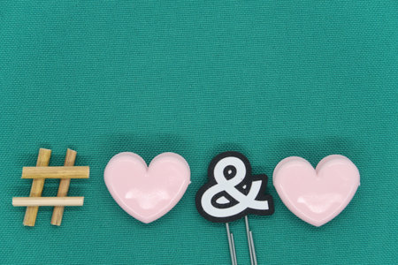 Heart shaped paper clips and hashtag sign, social media communication symbol, netの写真素材
