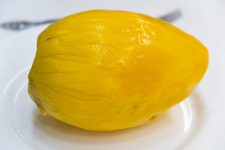 Ripe juicy peeled mango on a plate, dietの写真素材